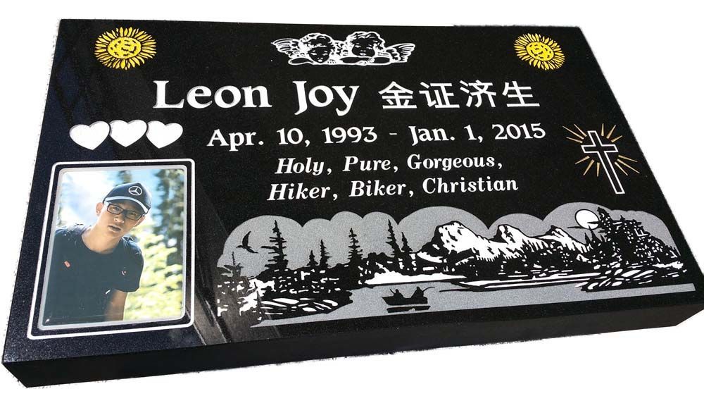 A gravestone for leon joy with a picture of him on it
