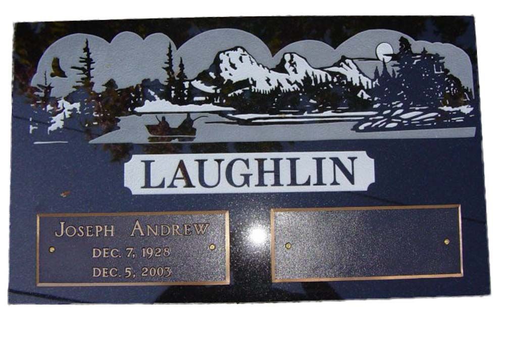 A plaque for laughlin with a picture of mountains and trees