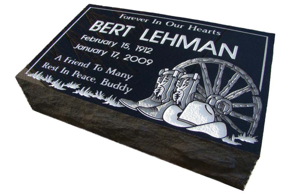 A black gravestone for bert lehman with a wagon wheel on it