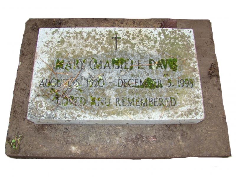 a gravestone for mary marie paws dated december 3 1998
