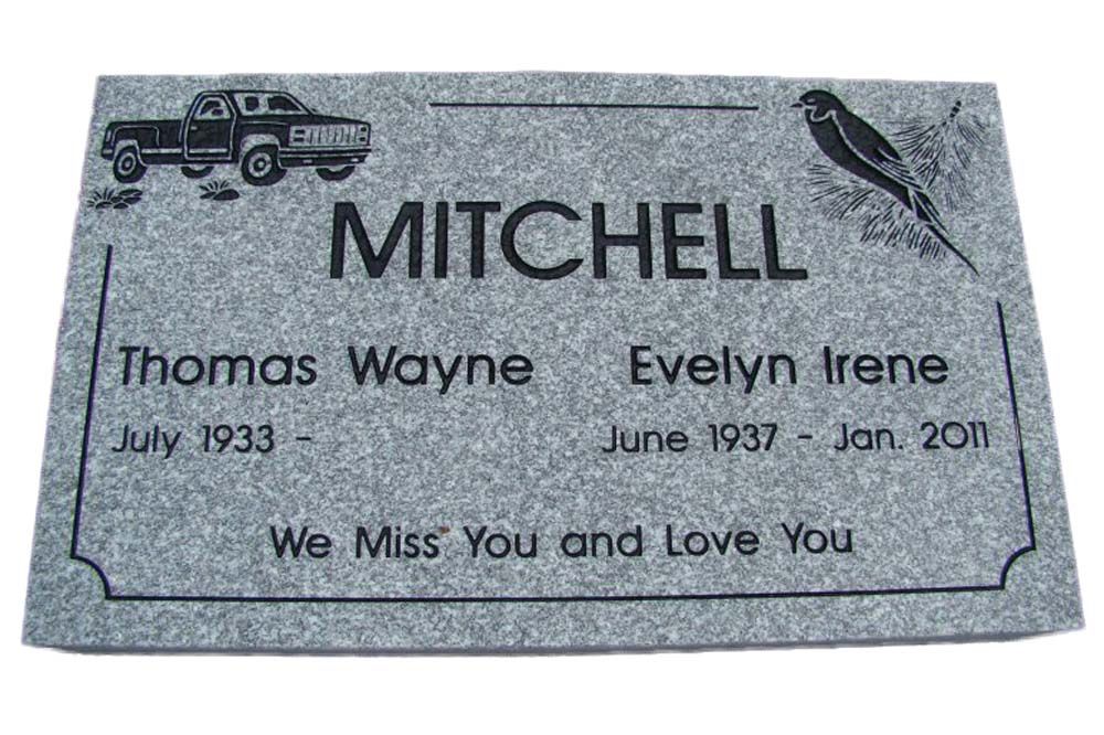 A gravestone for mitchell thomas wayne and evelyn irene