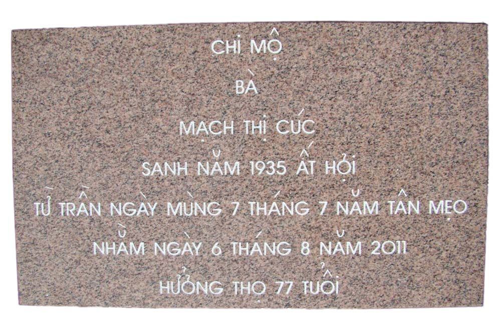 A stone plaque with chinese writing on it on a white background.