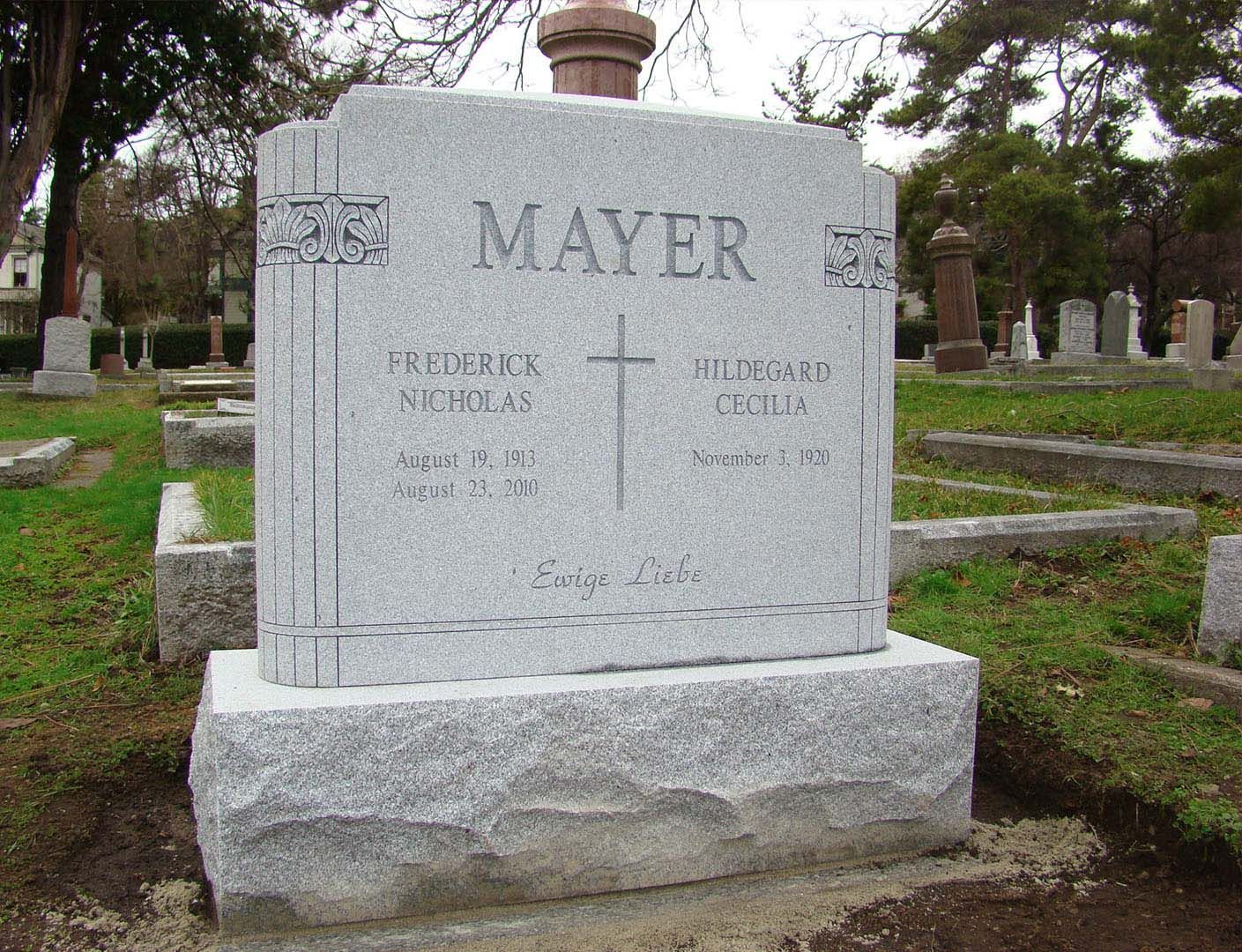 a gravestone in a cemetery with the name mayer on it