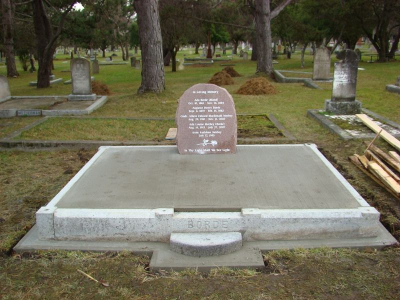 a grave in a cemetery with the name george on it