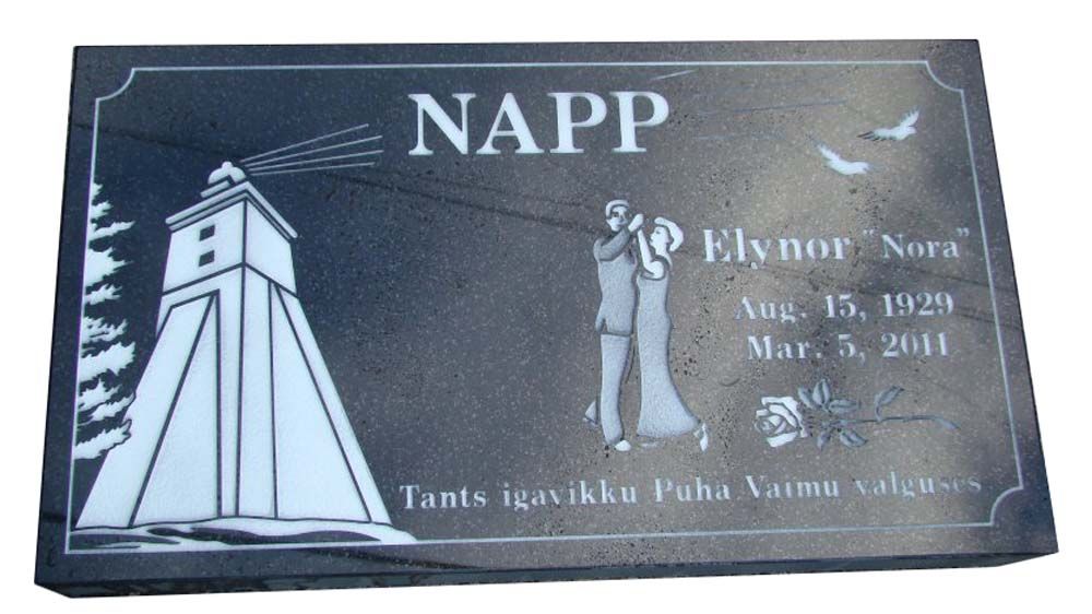 A gravestone for napp with a lighthouse on it