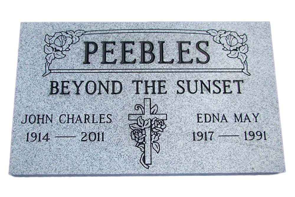A gravestone for peebles beyond the sunset with a cross on it