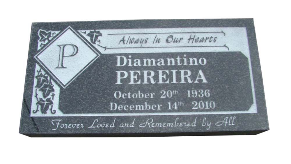 A gravestone for diamantino pereira who died on december 11 2010