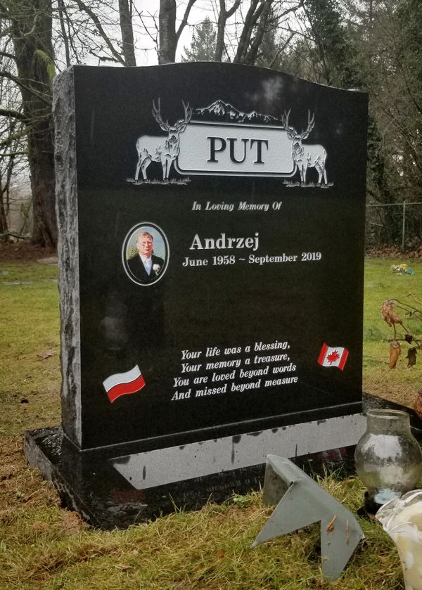 a black gravestone with the name put on it
