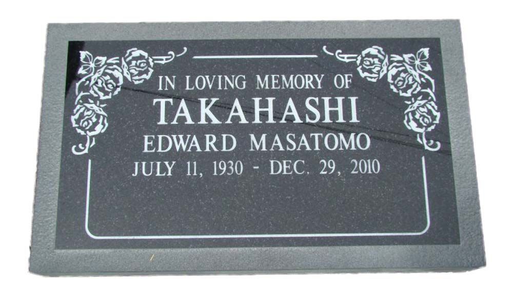 A black grave marker for takahashi edward masatomo