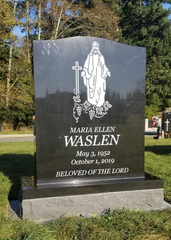 a gravestone for maria ellen waslen in a cemetery .