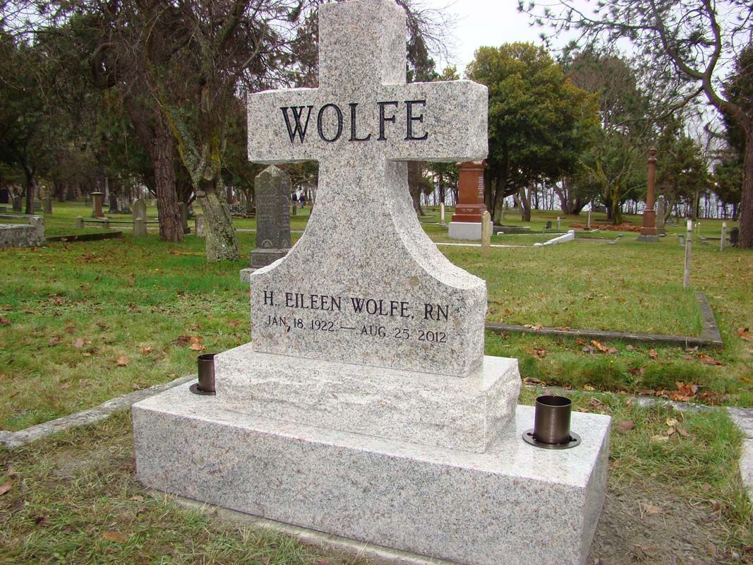a gravestone for wolfe is in a cemetery .