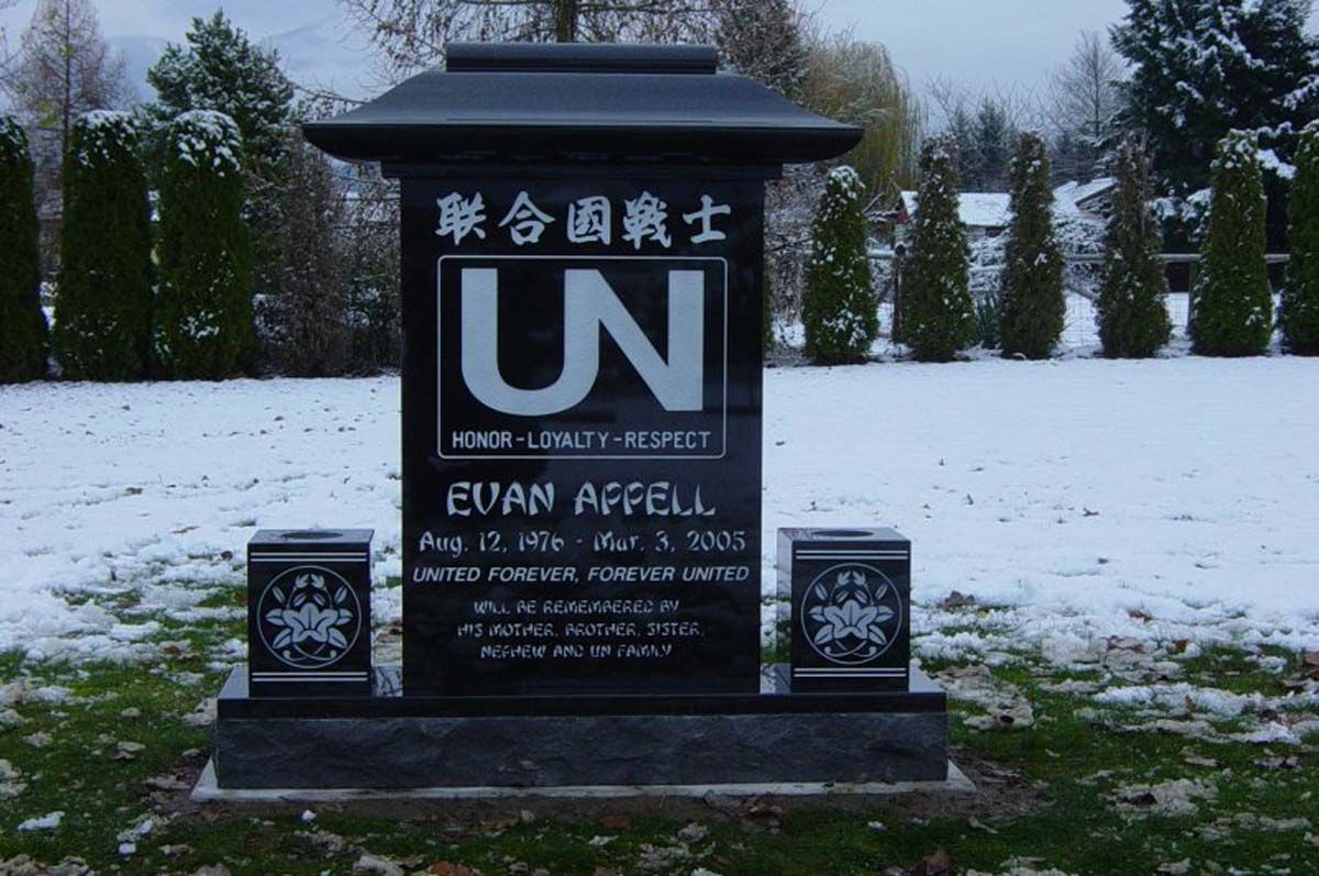A gravestone for evan affell is surrounded by snow