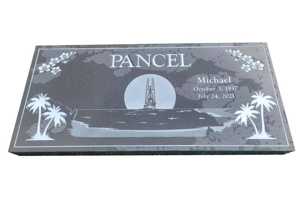 a black gravestone with palm trees and a tower on it .