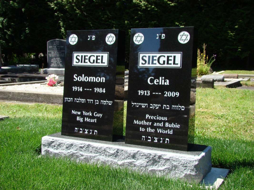 Two black stones with the name siegel on them in a cemetery