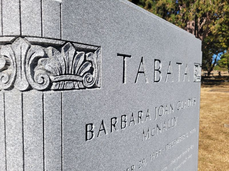 a gravestone for barbara tabata is in a cemetery .