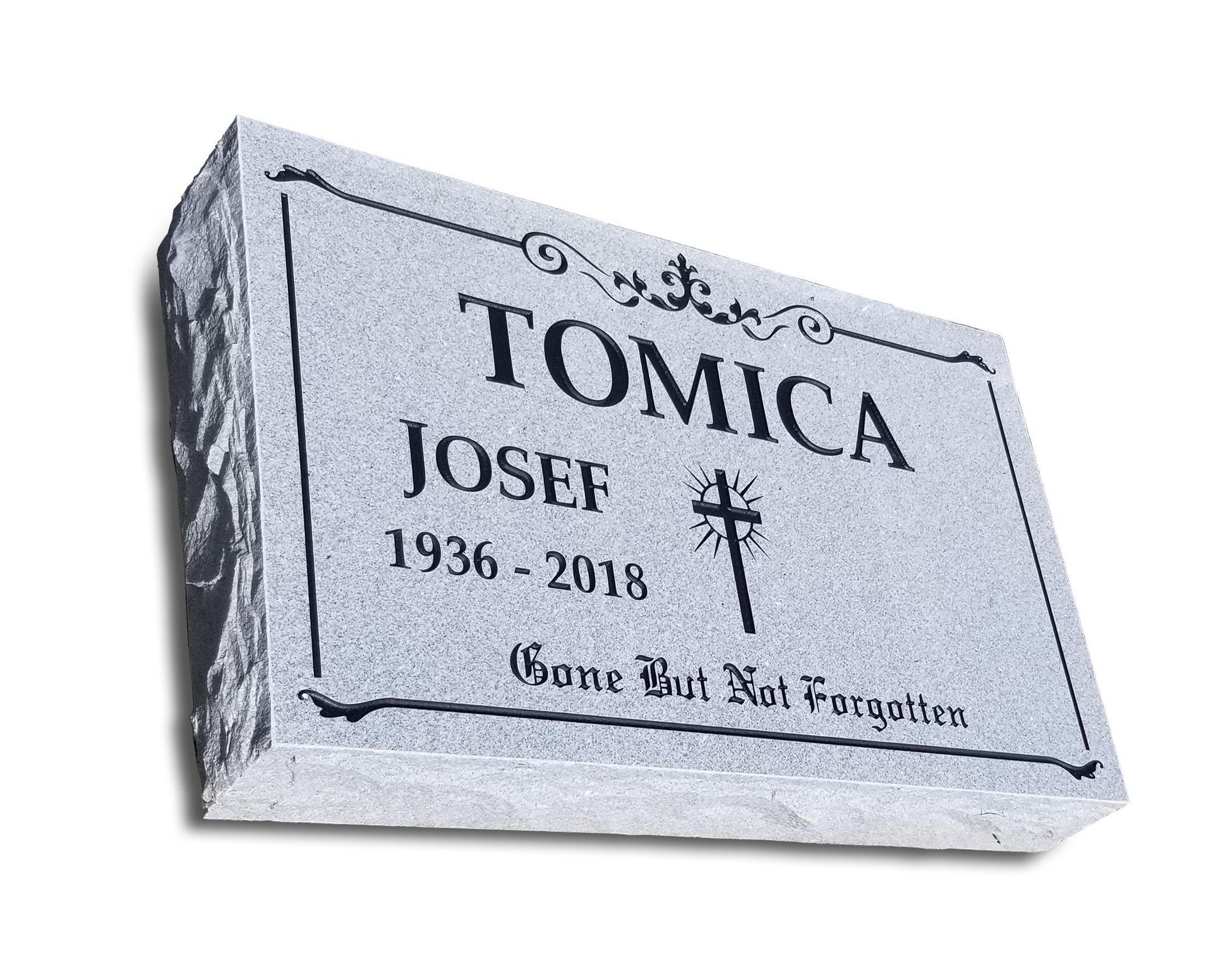 A gravestone for tomica josef 1936-2018 with a cross on it.