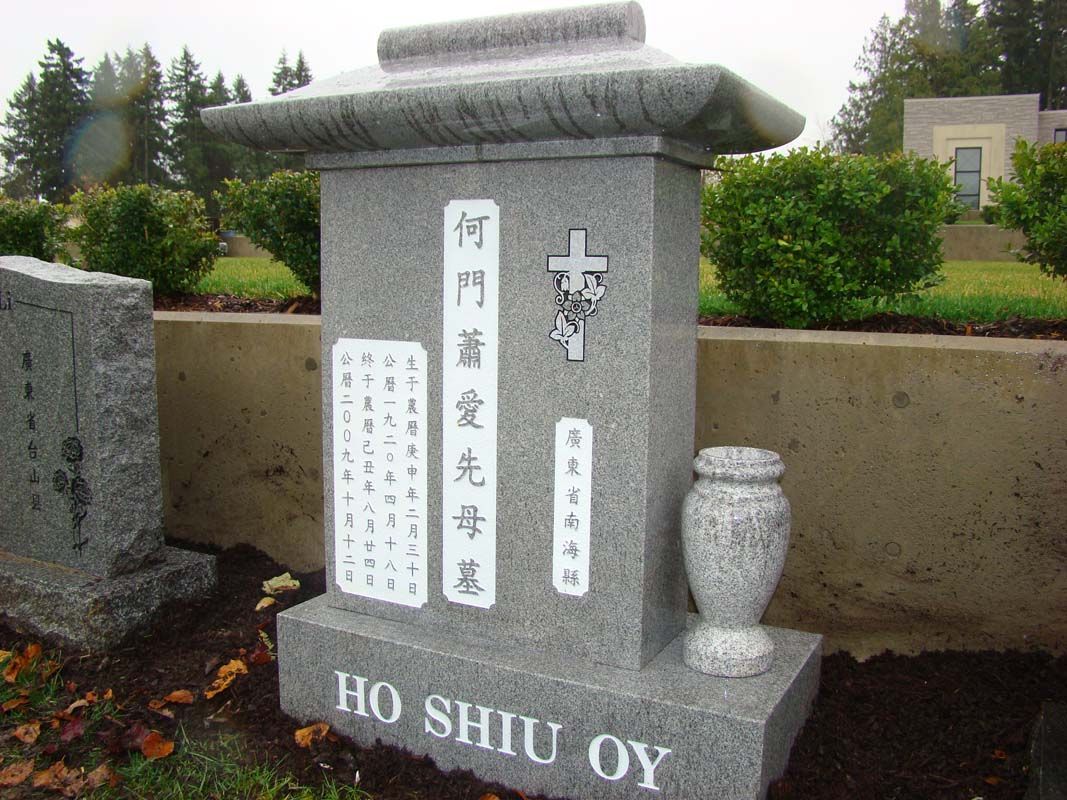 a gravestone for ho shiu oy in a cemetery