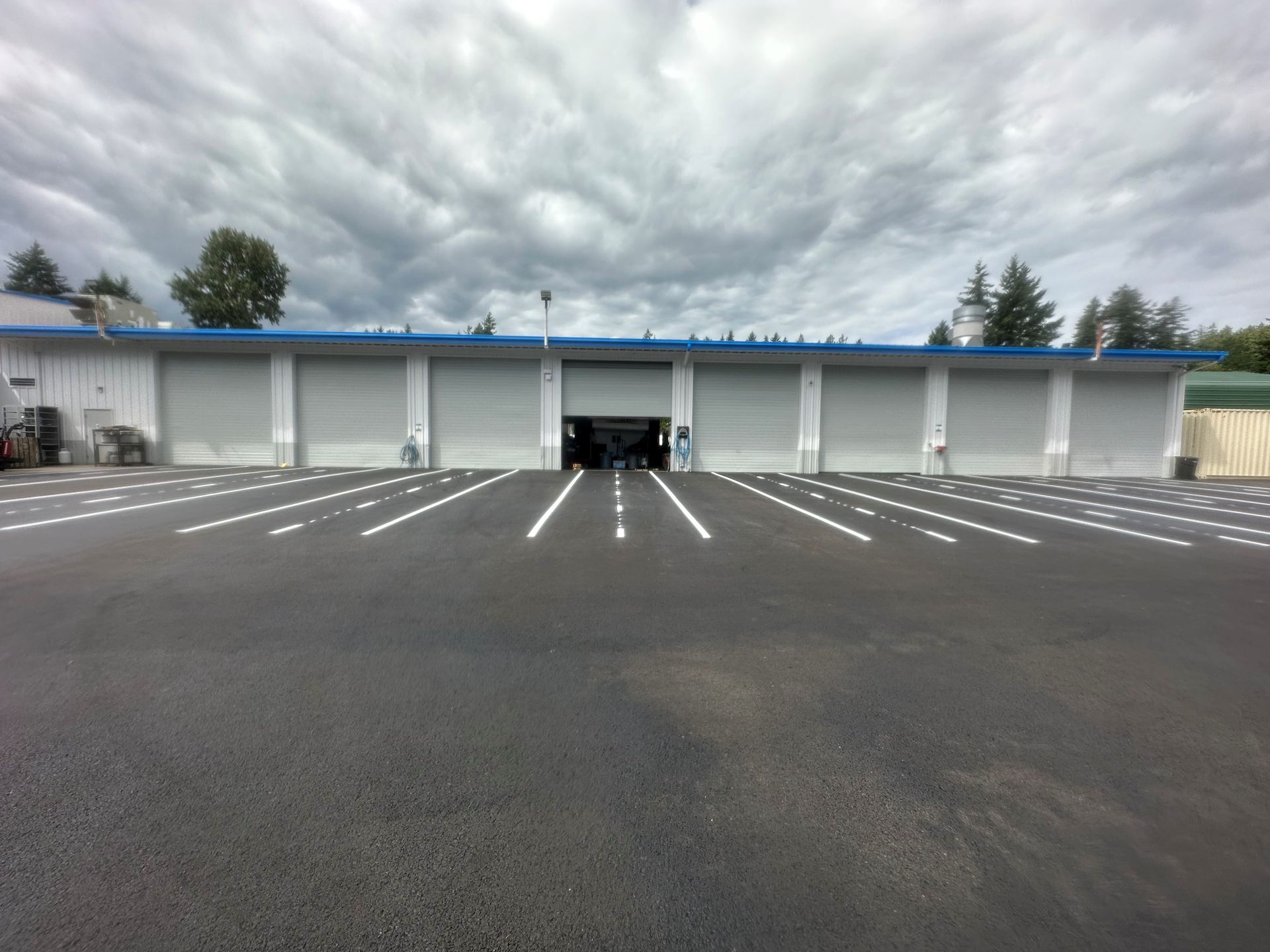 Two yellow lines are painted on the side of a road.