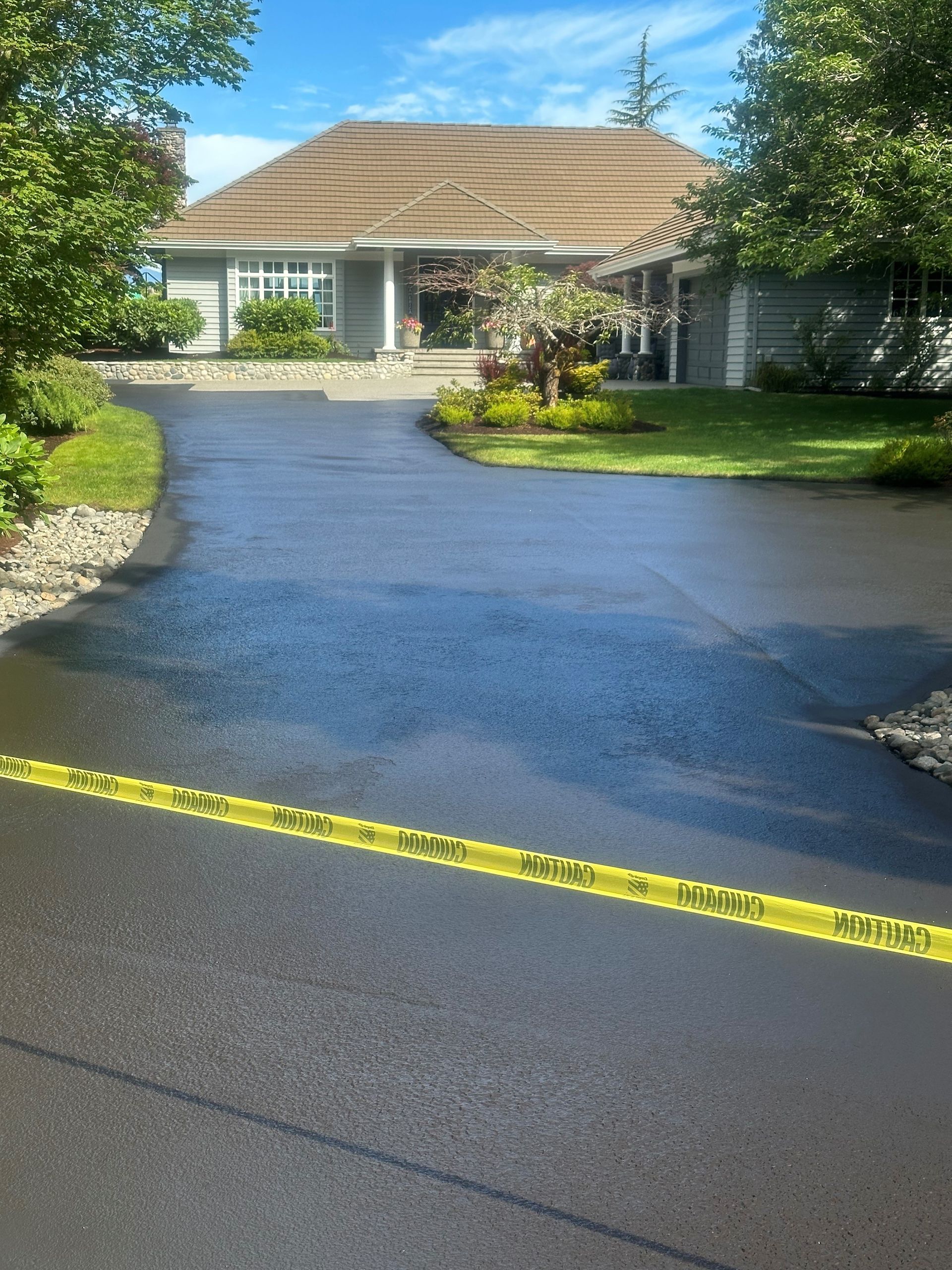 A group of construction workers are working on a road