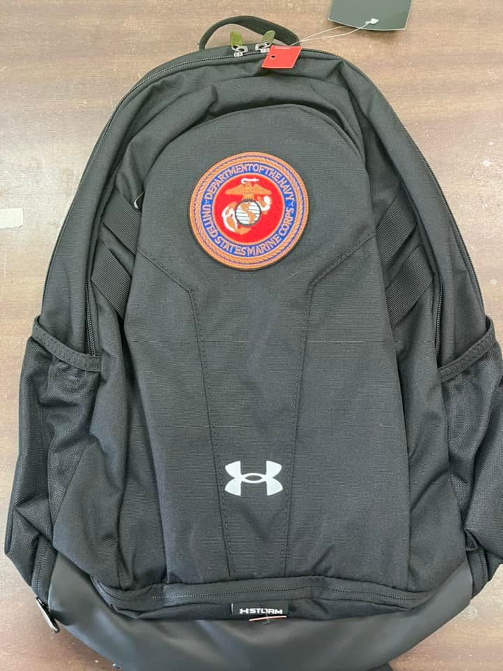 Black Under Armour backpack with a U.S. Marine Corps patch.