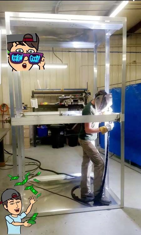 A man is welding a piece of metal in a room.