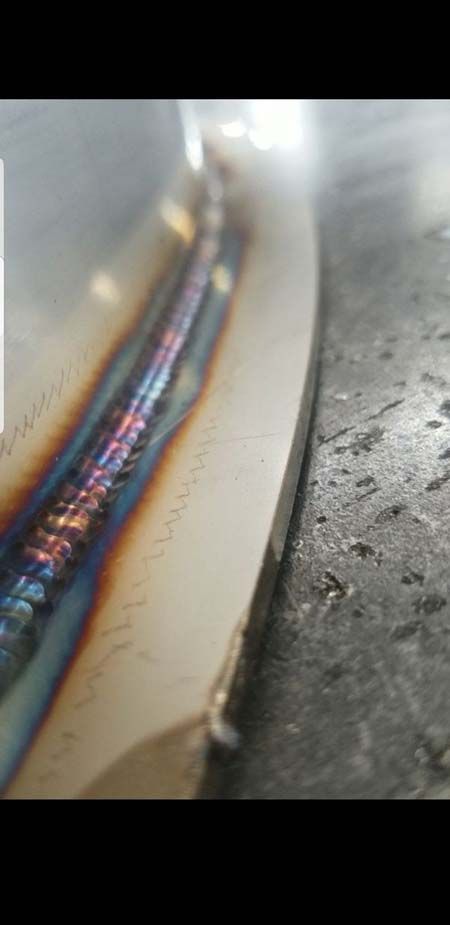 A close up of a welding joint on a piece of metal.