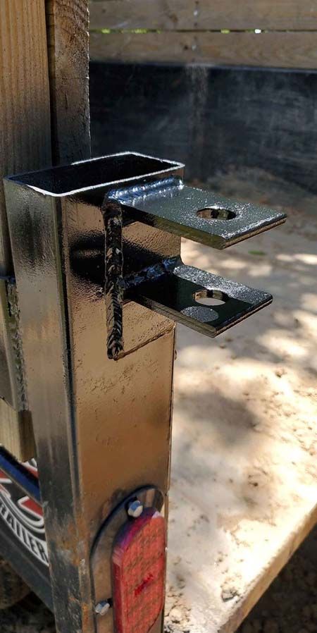 A close up of a metal object sitting on top of a wooden table.