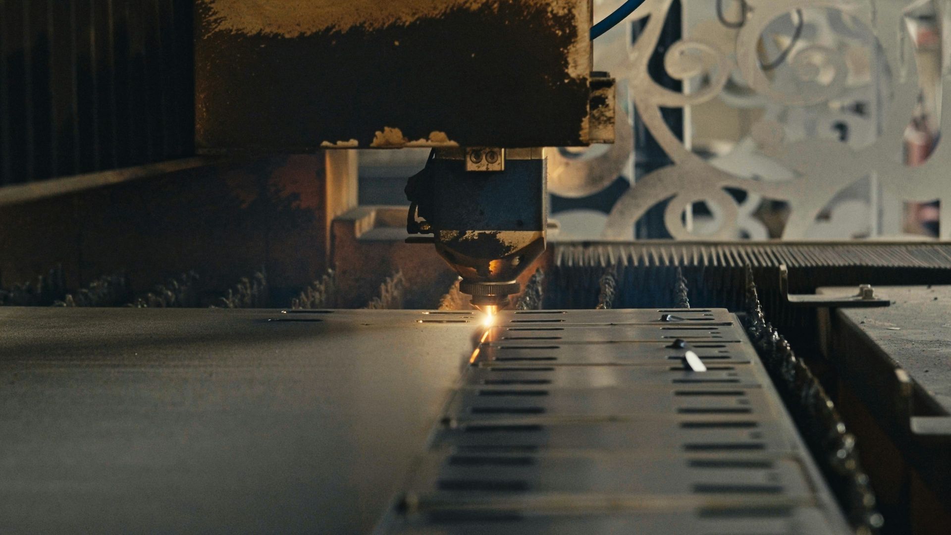 A machine is cutting a piece of metal with a laser.