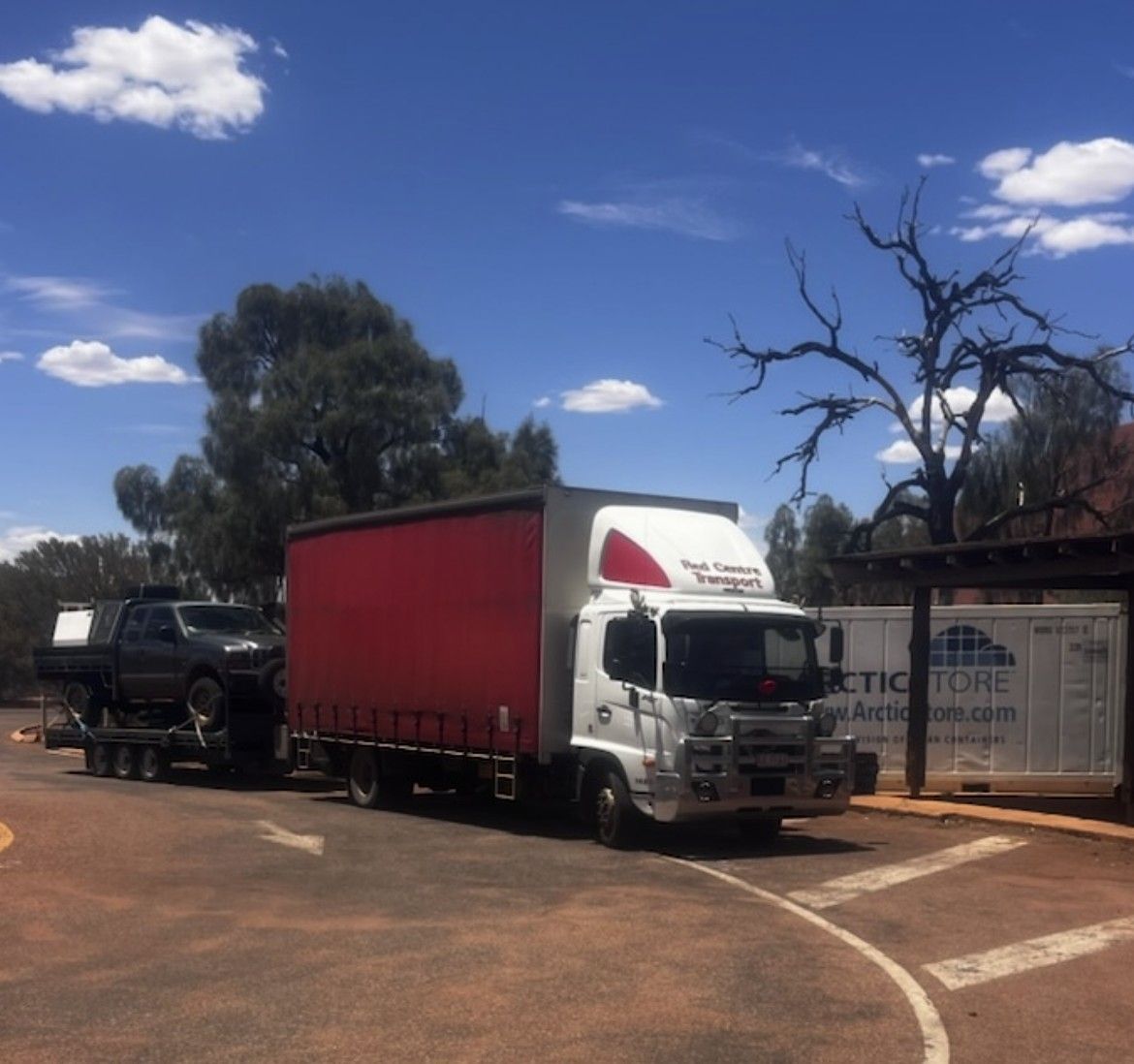 Row of parked scooters in various colors, showcasing front wheels and fenders. — Red Centre Transport in Braitling, NT