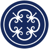 White decorative quatrefoil design on a navy blue background, within a circular border.