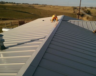 Staff Working on a Metal Roof — Elk Horn, IA — Modern Roofing LLC
