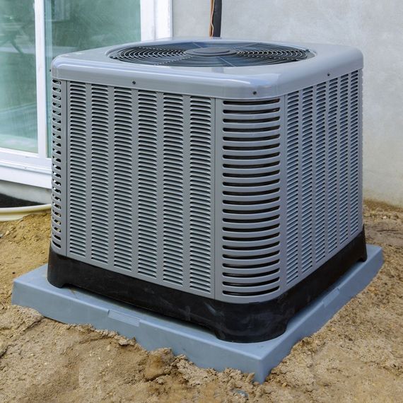 An air conditioner outside of the house