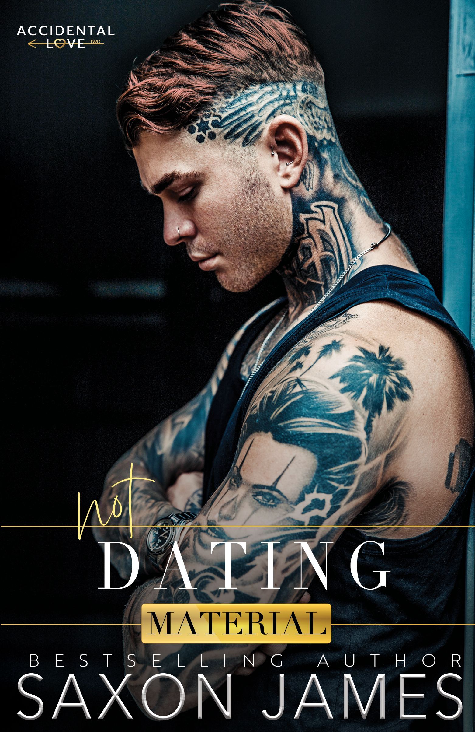 A man with a lot of tattoos on his body is standing next to a wall.