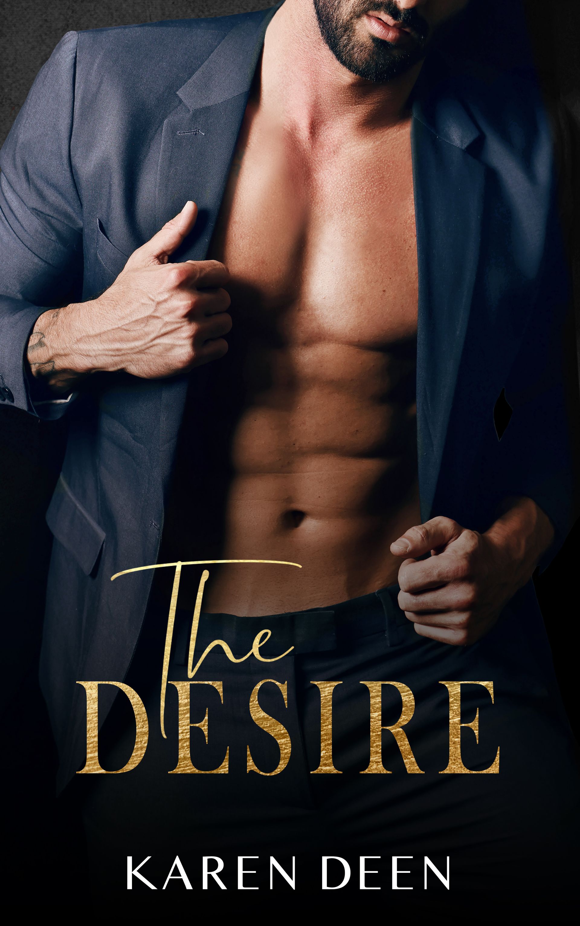 A shirtless man in a suit is on the cover of the book The Desire by Karen Deen.