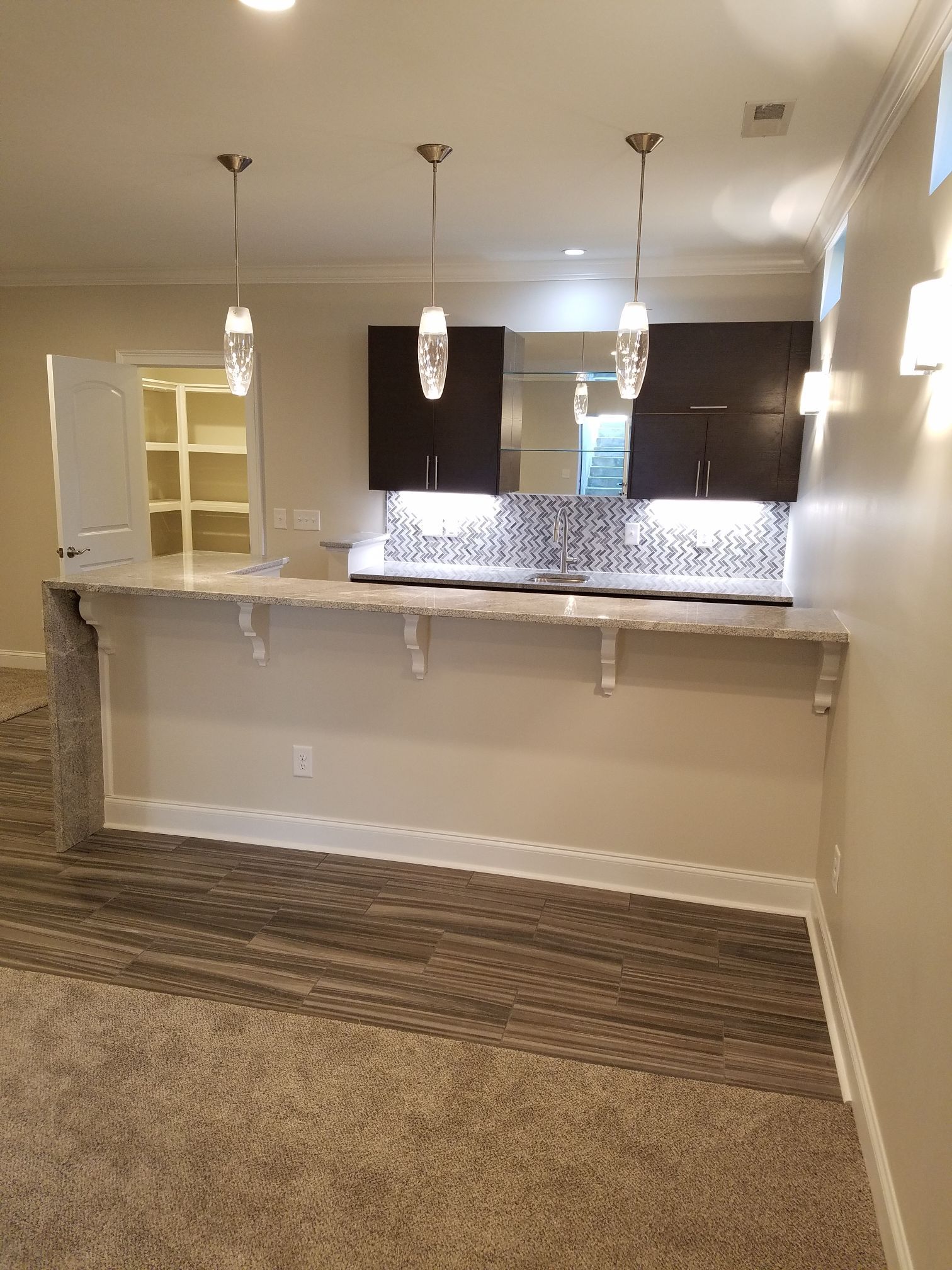 a kitchen with a large counter top and a sink