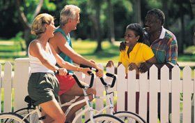 activities-hayle-penmeneth-house--couple-cycling-fence.jpg