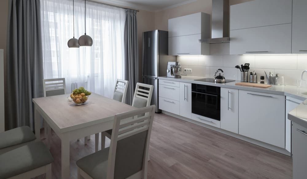 A Kitchen with White Cabinets — More on the Floor in Barrack Heights, NSW