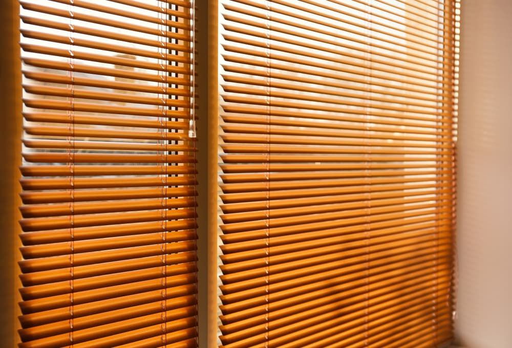 A Close up Of a Window with Wooden Blinds on It — More on the Floor in Barrack Heights, NSW