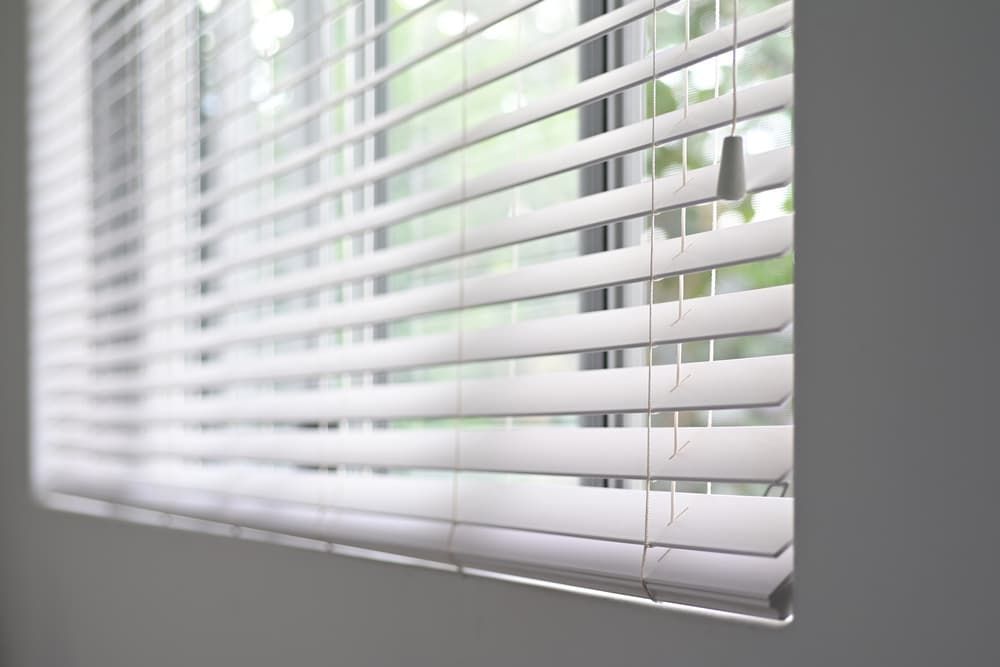 A Close up Of a Window with White Blinds — More on the Floor in Barrack Heights, NSW