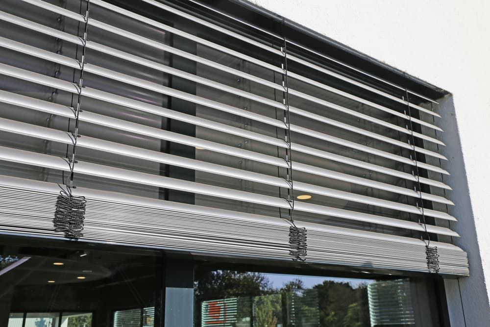 A Building with A Lot of Blinds on The Side of It — More on the Floor in Barrack Heights, NSW