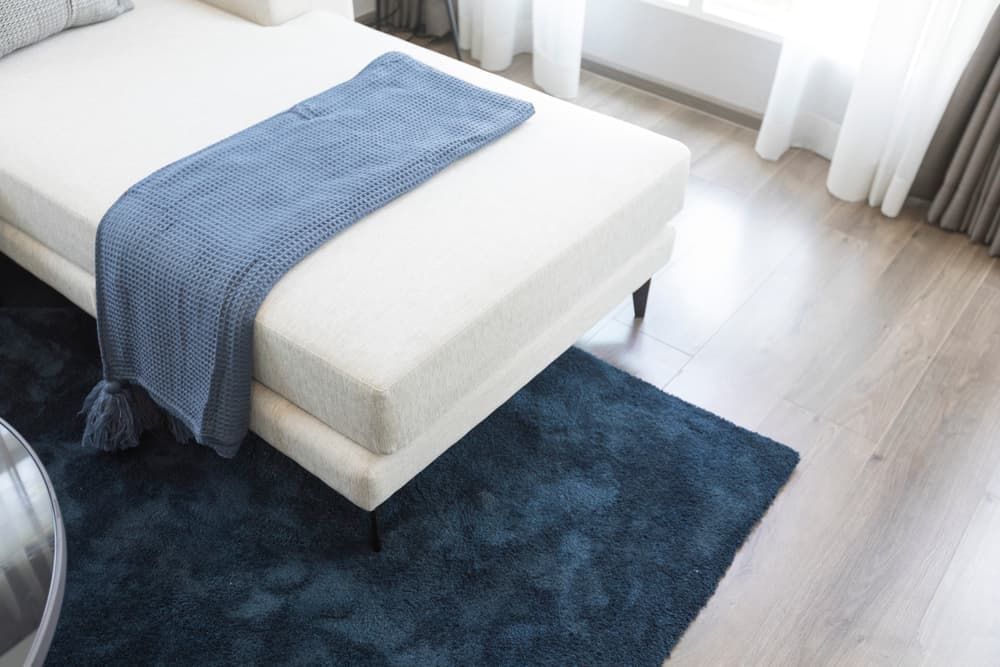A Bedroom with A Bed and A Blue Rug — More on the Floor in Barrack Heights, NSW