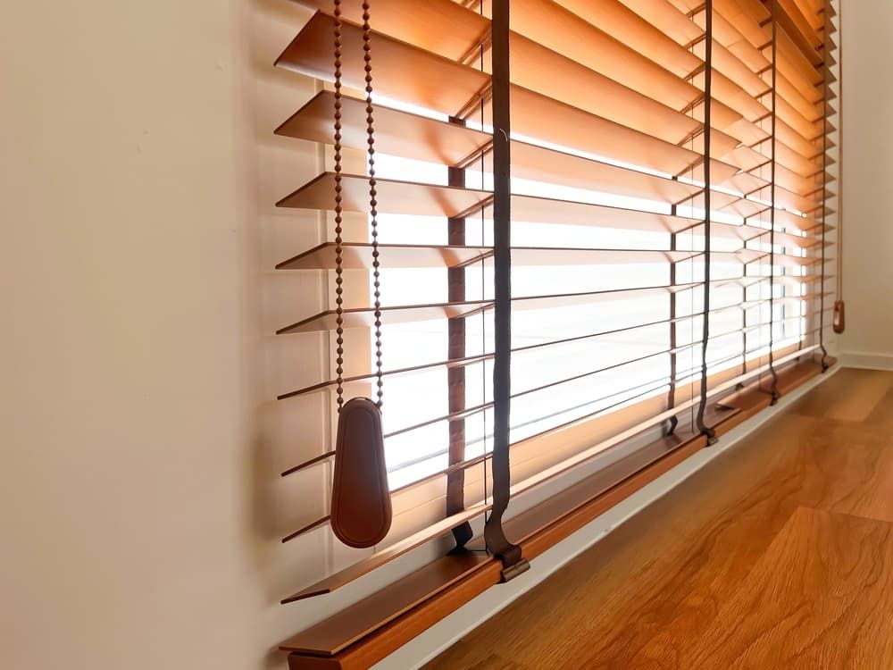 A Window with Wooden Blinds on It — More on the Floor in Barrack Heights, NSW