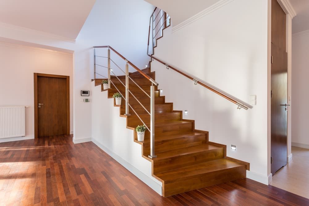A Wooden Staircase with A Metal Railing — More on the Floor in Barrack Heights, NSW