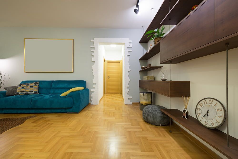 A Living Room with A Blue Couch — More on the Floor in Barrack Heights, NSW