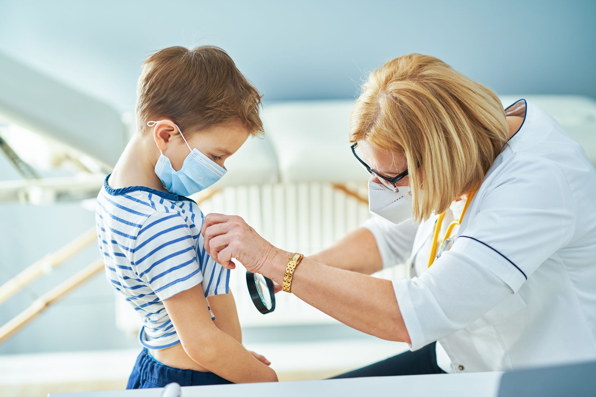 Board-certified pediatric dermatologist treating a child's skin condition.