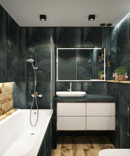 Modern bathroom with dark teal walls, white vanity, bathtub, and wood flooring.