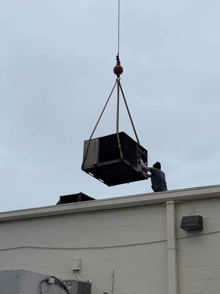 Person Holding HVAC On Roof - Chesapeake, VA - Southside Energy