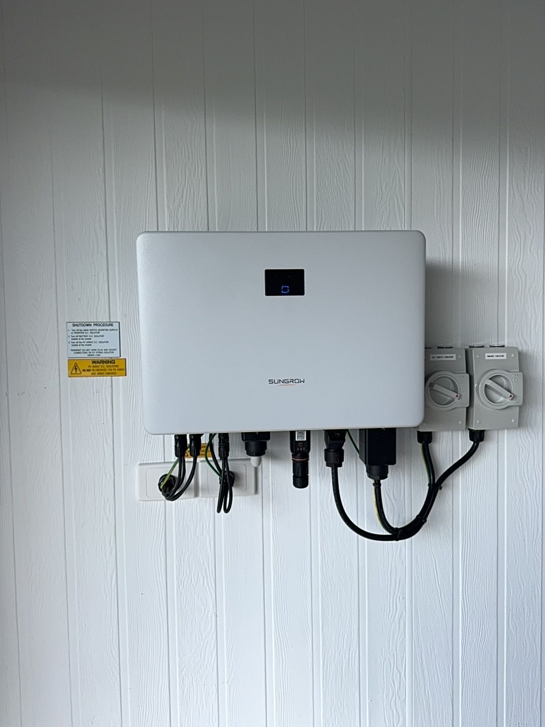 A White Box Is Hanging On A White Wooden Wall — Rid-Arc Electrical In Tamworth, NSW