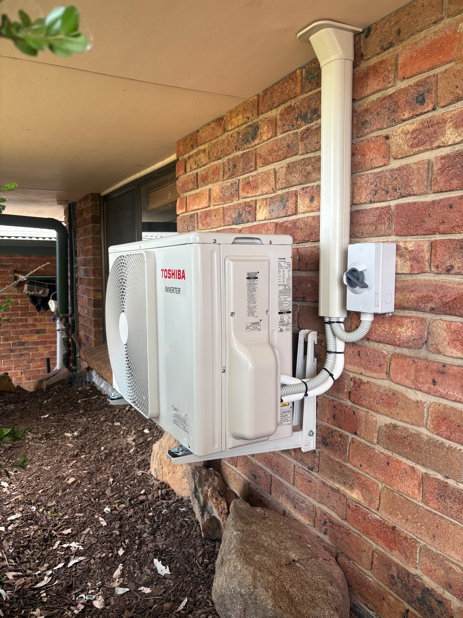 An Air conditioning Unit Is On The Wall — Rid-Arc Electrical In Tamworth, NSW