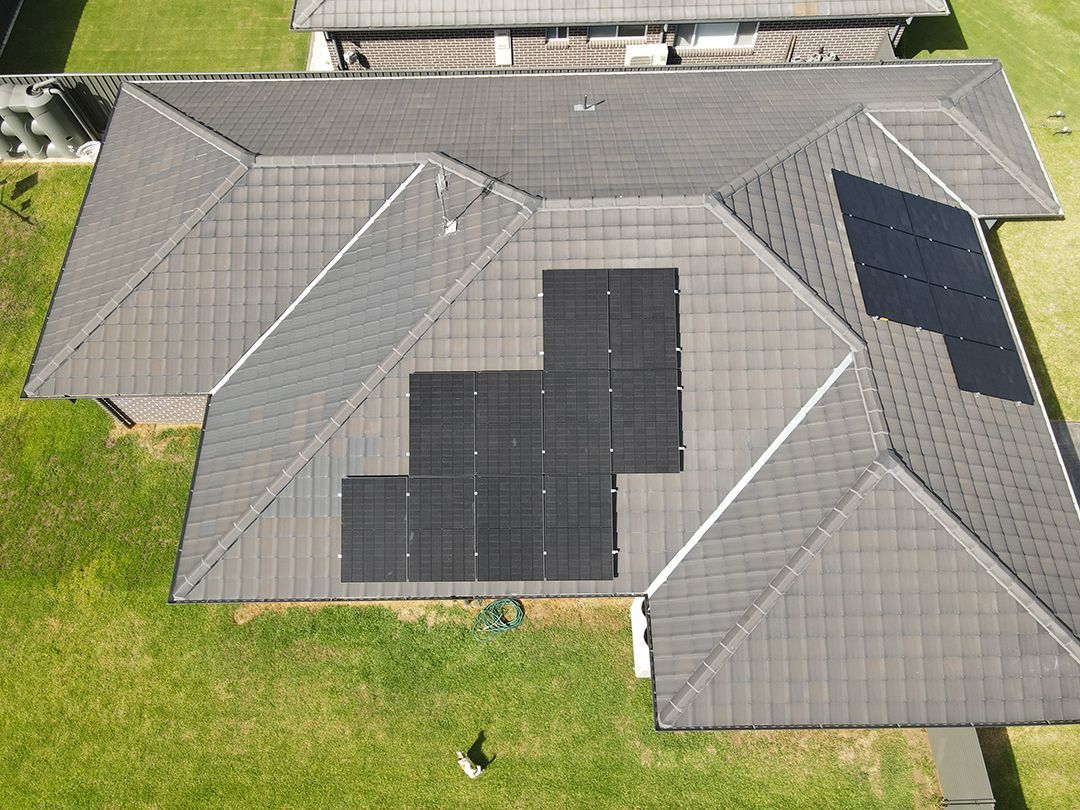 An Aerial View Of A House With Solar Panels On The Roof — Rid-Arc Electrical In Tamworth, NSW